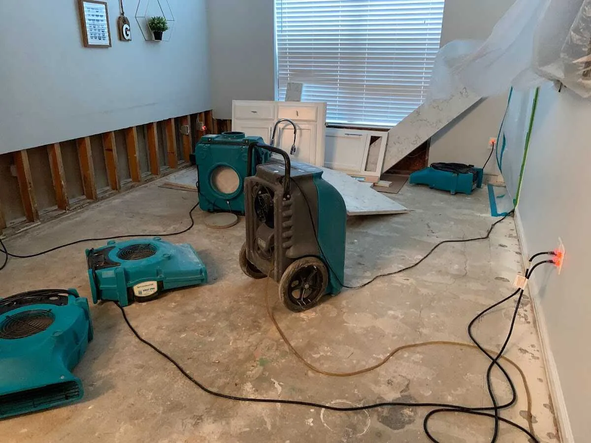Dehumidifier in flood-cut room for Water Damage Restoration in Bryan